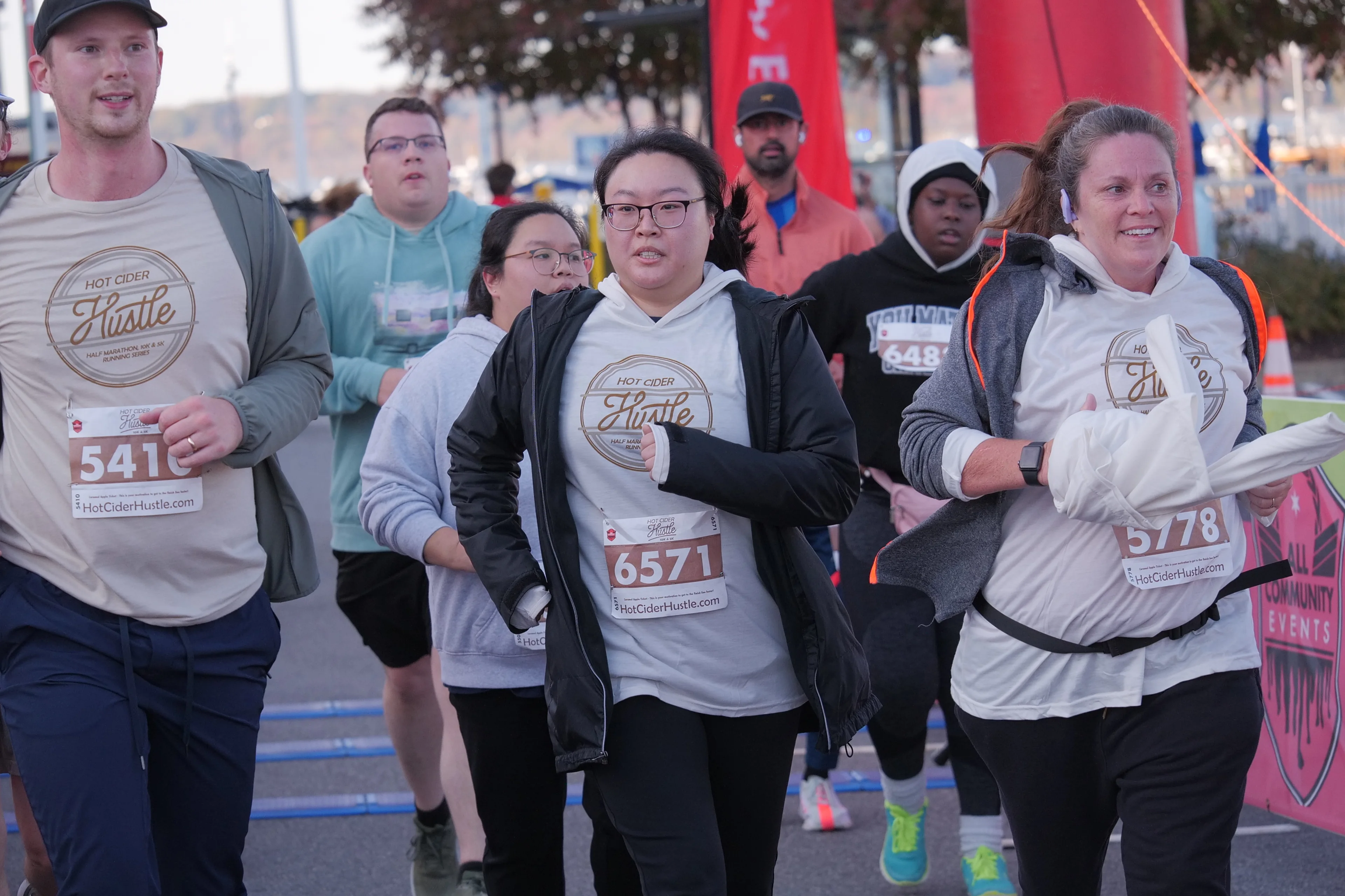 Runners moving through the finish area of a large outdoor event captured by Mighty Lux Media in Washington, DC.